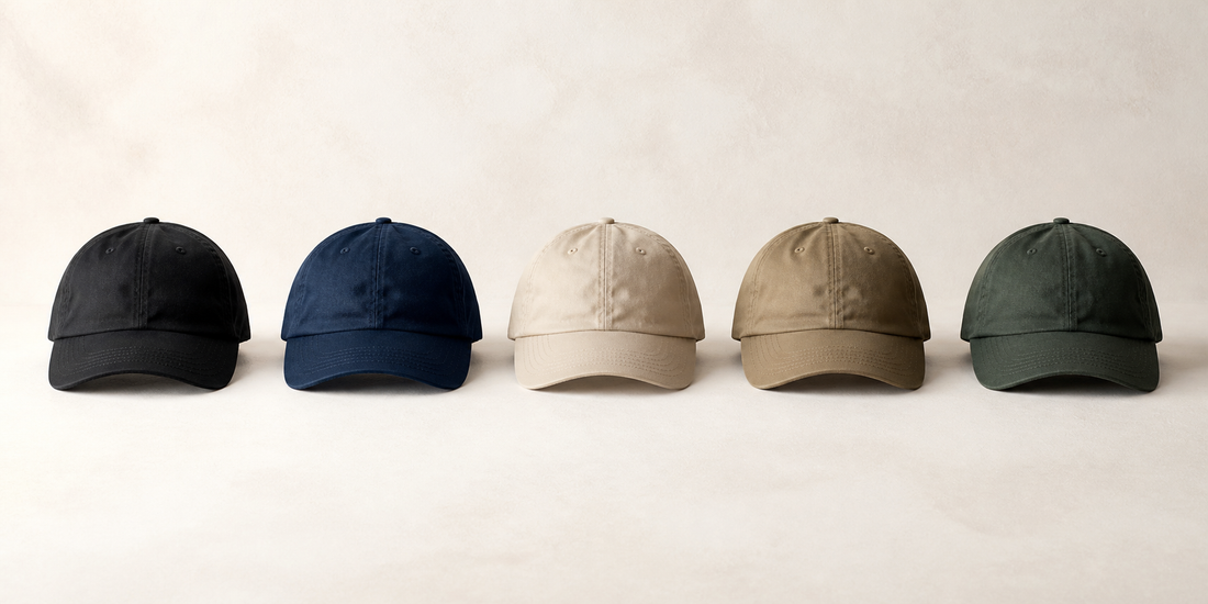 Five unbranded dad hats in black, navy, stone, khaki, and spruce